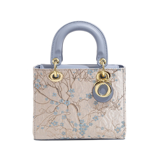 A embroidered shoulder bag messenger bag