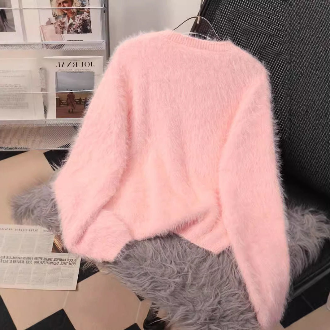 A diamond-encrusted fluffy top sweater