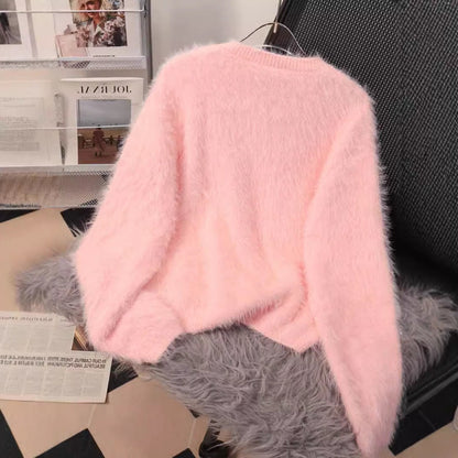 A diamond-encrusted fluffy top sweater