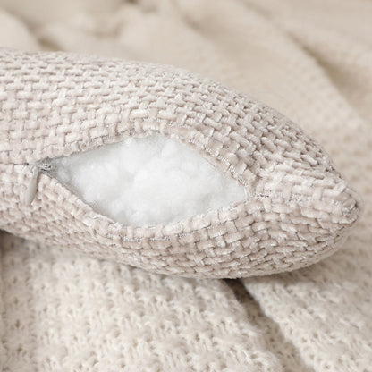 A knotted pillow throw pillow